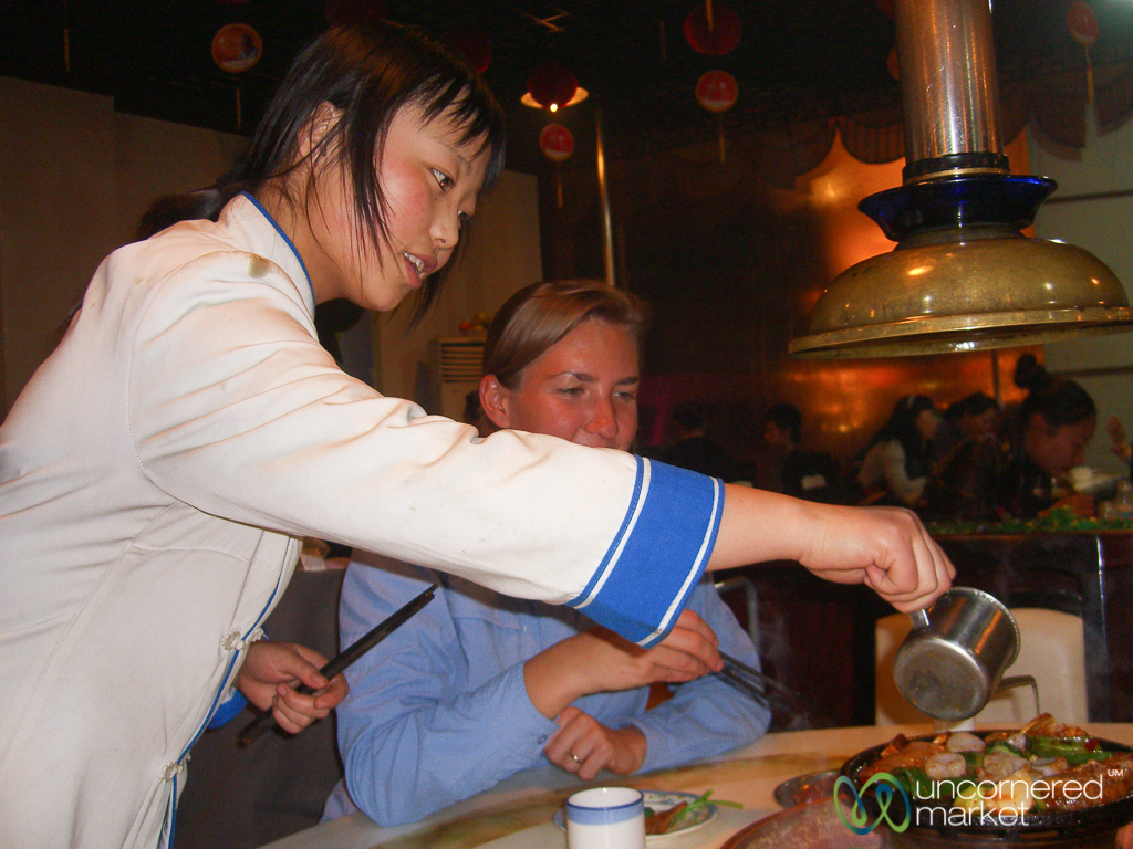 Guided through the proper Chinese hot pot experience in Urumqi, Xinjiang.